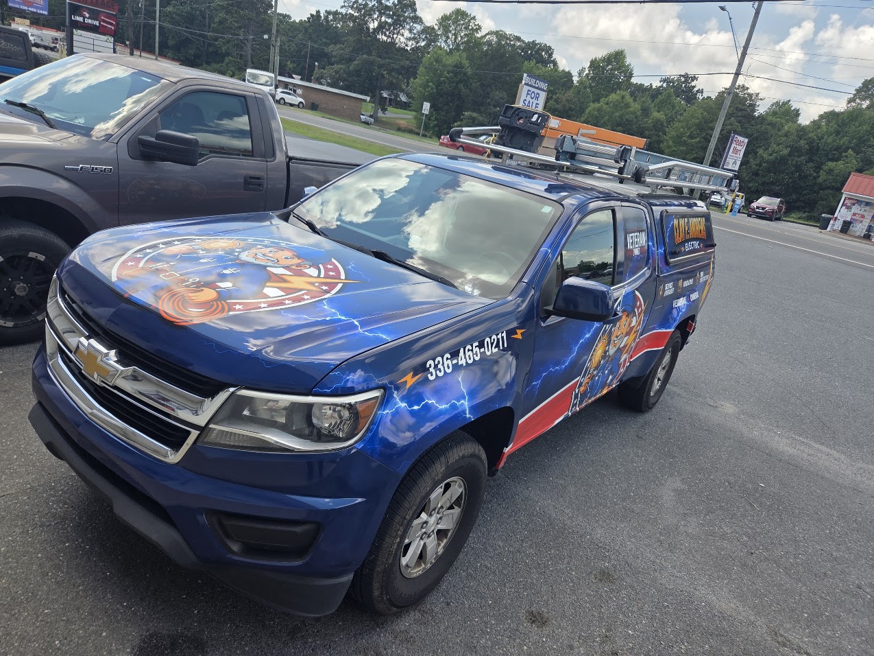 Completed Clay F. Andrews Electric truck wrap, front three-quarter view